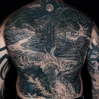 a large back tattoo of a phoenix in front of a fantasy landscape