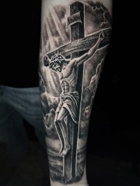 black and grey realism tattoo of Jesus on the forearm
