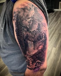 A photorealistic tattoo of a mountain landscape with waterfall