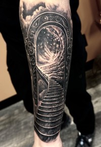 a black ink tattoo of a gateway and stairway to heaven