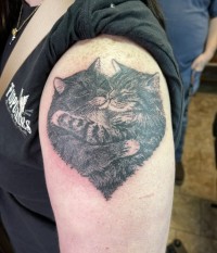 black and grey tattoo of two cats