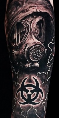 Black and white tattoo of a gas mask and biohazard symbol
