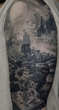 Black and white tattoo of a woman walking through a cemetery garden