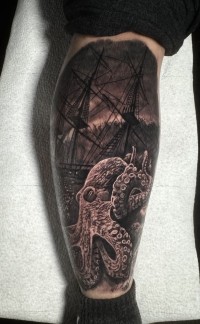 a tattoo of a giant octopus with a ship on a stormy sea