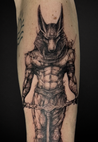 black and grey illustrative tattoo of Anubis