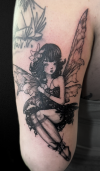 illustrative black and grey tattoo of a fairy