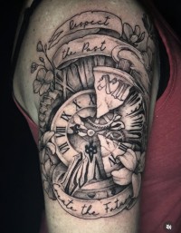 a tattoo of an abstract clack with flowers