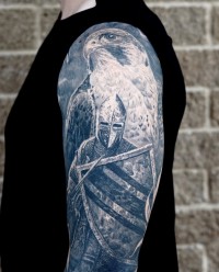 black and grey realism tattoo of a medieval knight and a falcon