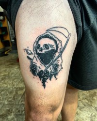 Tattoo of a drawing of a space-themed grim reaper