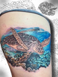 A color tattoo of an ocean scene featuring a sea turtle